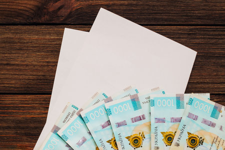 Ukrainian money hryvnias on the table with documents with a place for text.の写真素材