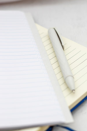 The pen lies in the notebook, the concept of study, time management.の写真素材