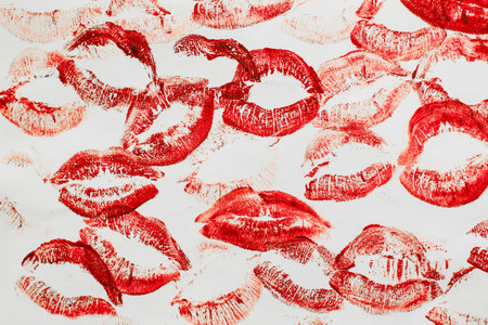 Lip prints of cosmetic lipstick on a light background.の写真素材