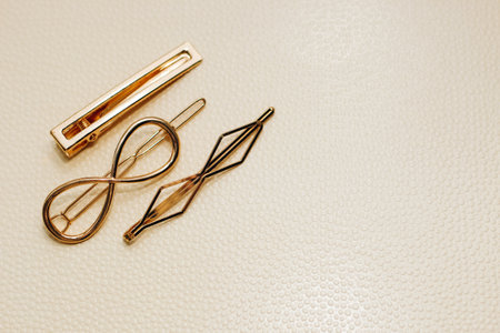 Gold ornaments from yellow metal on a light background.の写真素材