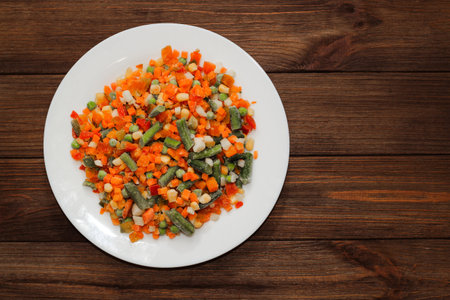 Frozen vegetables carrots, peas, beans in a plate.の写真素材