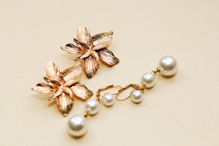Gold ornaments from yellow metal on a light background.の写真素材