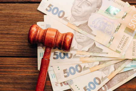 Gavel judges on the table with Ukrainian hryvnias in the denomination of 500 hryvnias.の写真素材