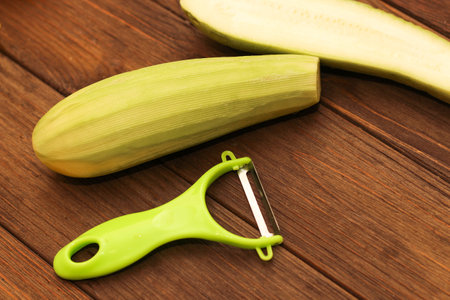 Chopped zucchini into strips, with a light green peeler.の写真素材