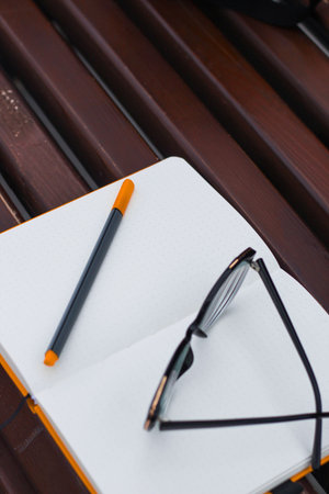 Glasses for vision on a notepad with a marker, study concept.