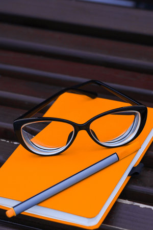Glasses for vision on a notepad with a marker, study concept.の写真素材