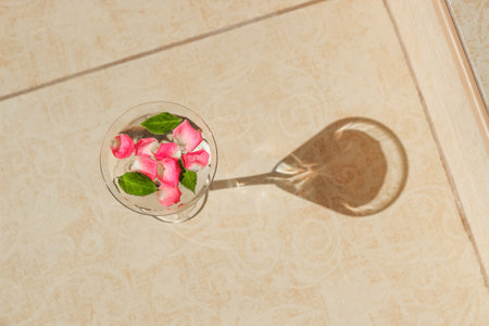 Rose petals in a martini glass, concept of beauty, style and fashion.の写真素材