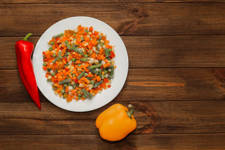 Frozen vegetables carrots, peas, beans in a plate.の写真素材