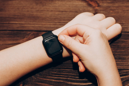 Black technological smart watch in hand.の写真素材