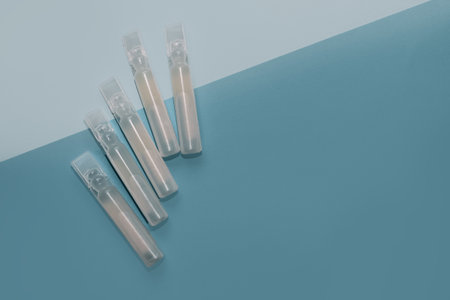 Probiotics medicine in vial on blue background.の写真素材