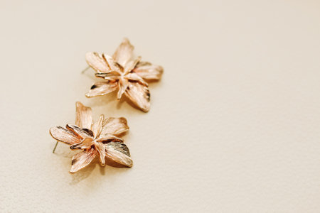 Gold ornaments from yellow metal on a light background.の写真素材