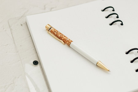 The pen lies in the notebook, the concept of study, time management.の写真素材