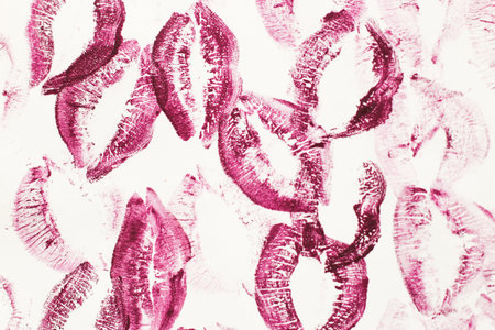 Lip prints of cosmetic lipstick on a light background.の写真素材