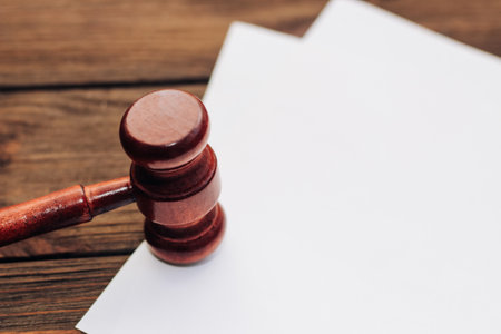 Gavel on the table with documents, place for text.の写真素材