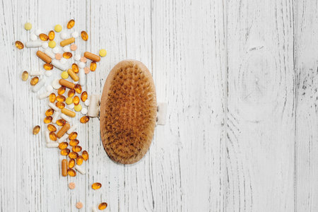 Massage wooden brush for dry massage against cellulite and vitamins.の写真素材