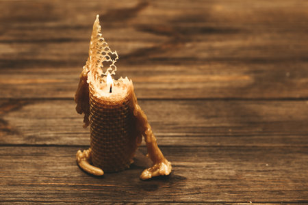 A candle made of natural wax is half burnt.の写真素材