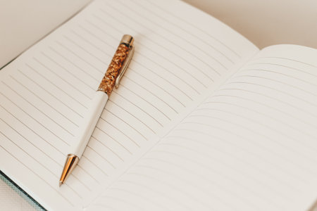 The pen lies in the notebook, the concept of study, time management.の写真素材