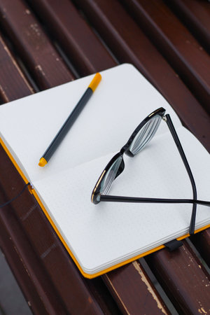 Glasses for vision on a notepad with a marker, study concept.の写真素材