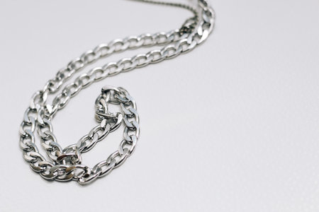 Different silver metal chains on a light background.の写真素材