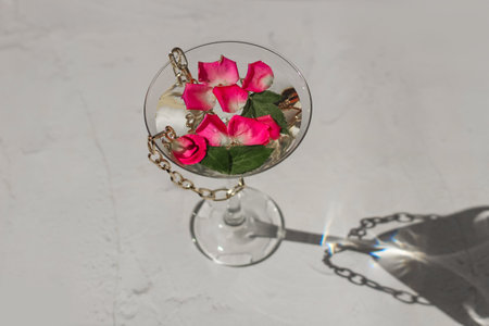 Rose petals in a martini glass, concept of beauty, style and fashion.の写真素材