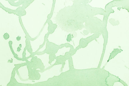 Watercolor green splashes dilution spots background.の写真素材