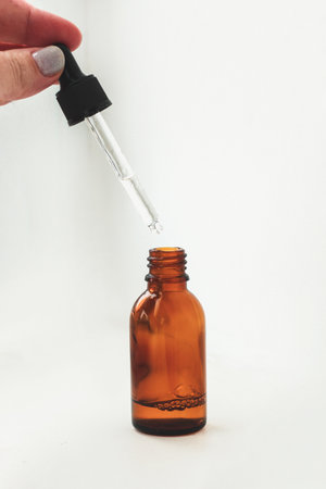 Serum for skin, face care in a brown glass jar.の写真素材