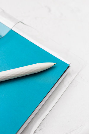 The pen lies in the notebook, the concept of study, time management.の写真素材