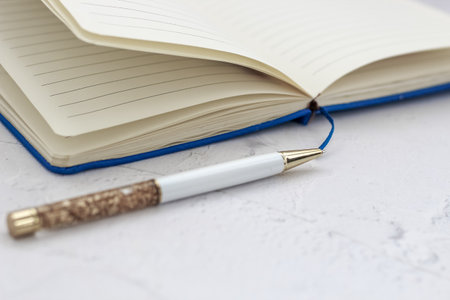 The pen lies in the notebook, the concept of study, time management.の写真素材