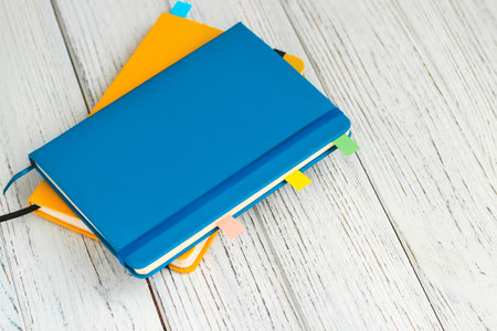 Notebook diary for planning in blue and yellow.の写真素材