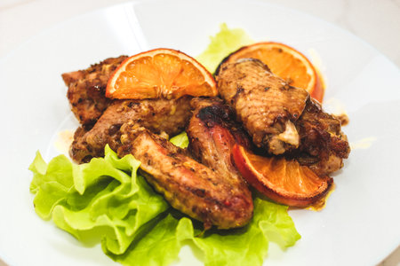 Baked chicken wings with honey and orange.の写真素材