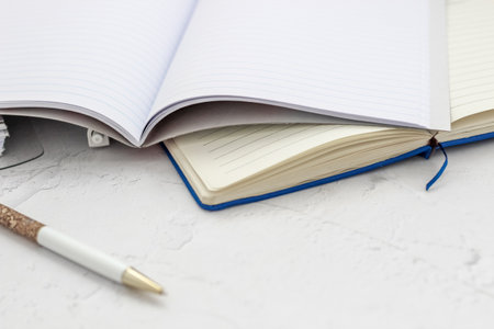 The pen lies in the notebook, the concept of study, time management.の写真素材