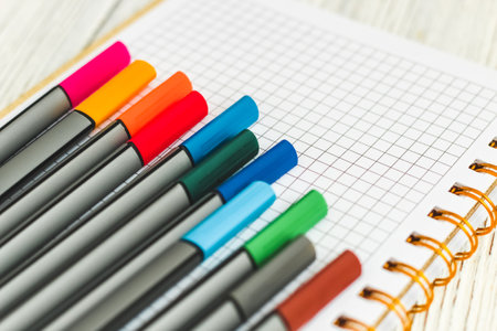 Notebook diary for planning and studying on the table with colored markers.の写真素材
