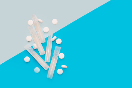 Probiotics medicine in vial on blue background.の写真素材