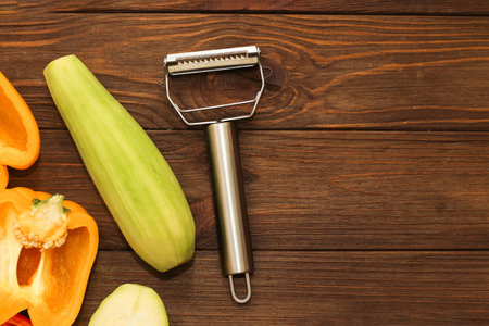 Chopped vegetables, carrots, peppers, zucchini on a vegetable peeler.の写真素材