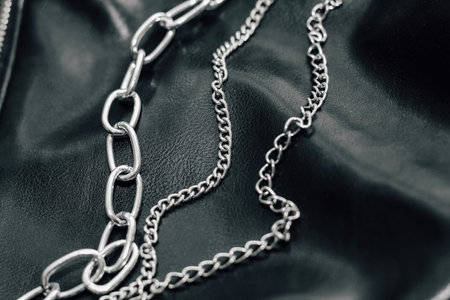 Chain on black texture eco soft leather, fashionable jacket.の写真素材