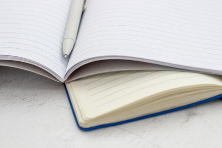 The pen lies in the notebook, the concept of study, time management.の写真素材