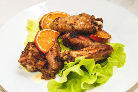 Baked chicken wings with honey and orange.の写真素材