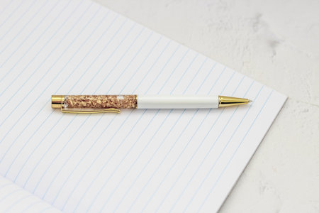 The pen lies in the notebook, the concept of study, time management.の写真素材