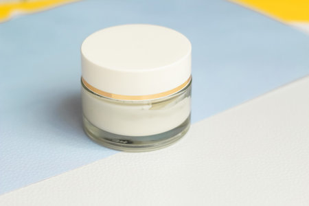 Moisturizing spf cream in a jar on a light backgroundの写真素材