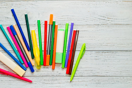 Stationery, colored felt-tip pens on a white table.の写真素材