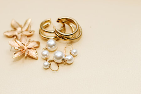 Gold ornaments from yellow metal on a light background.の写真素材