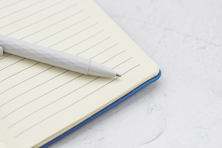 The pen lies in the notebook, the concept of study, time management.の写真素材