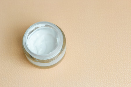 Moisturizing spf cream in a jar on a light backgroundの写真素材