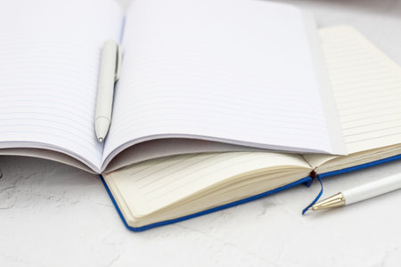The pen lies in the notebook, the concept of study, time management.の写真素材