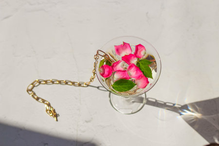 Rose petals in a martini glass, concept of beauty, style and fashion.の写真素材