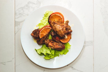 Baked chicken wings with honey and orange.の写真素材
