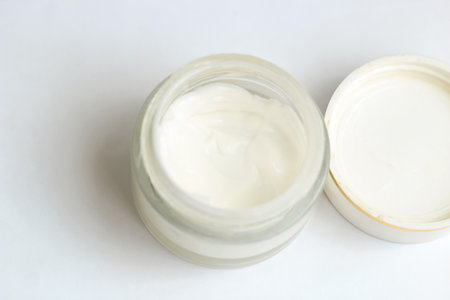 Moisturizing spf cream in a jar on a light backgroundの写真素材