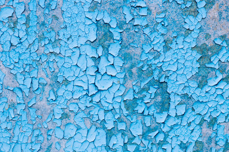 Blue texture of old cracked paint, grunge background.の写真素材