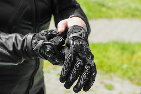 The girl wears protective moto gloves, safe equipmentの写真素材