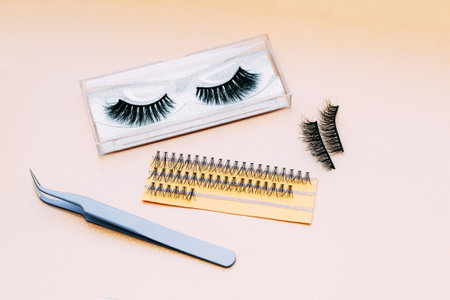 Artificial false fluffy eyelashes with tweezers.の写真素材